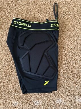 STORELLI Padded Compression Shorts in Black with Neon Yellow Trim Soccer